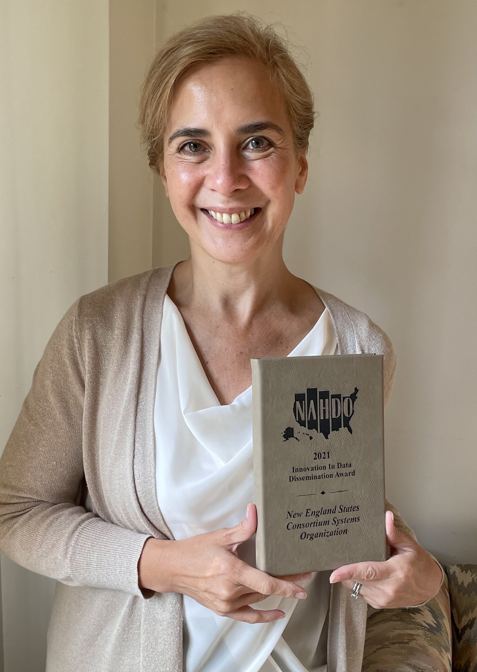 Elena Nicolella receives an award